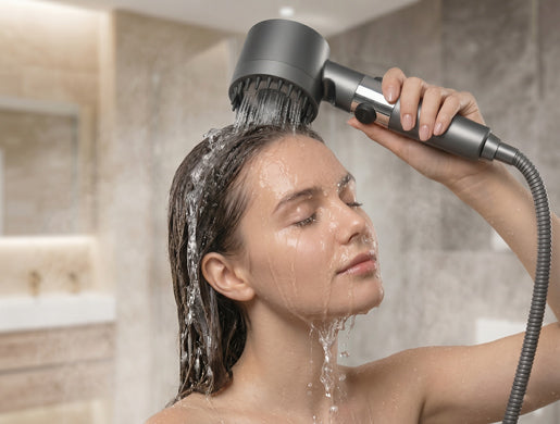 Woman using ShowerFlowLuxe massage nodes on scalp